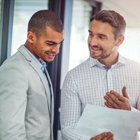 Two business men discussing work