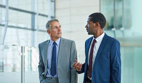 Two business men discussing work